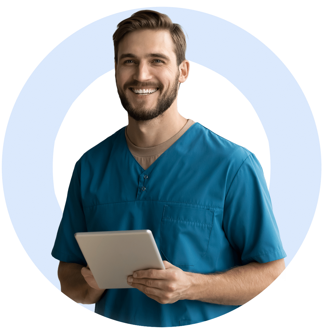 Smiling man in scrubs holding tablet
